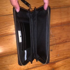 black and gold studded wristlet